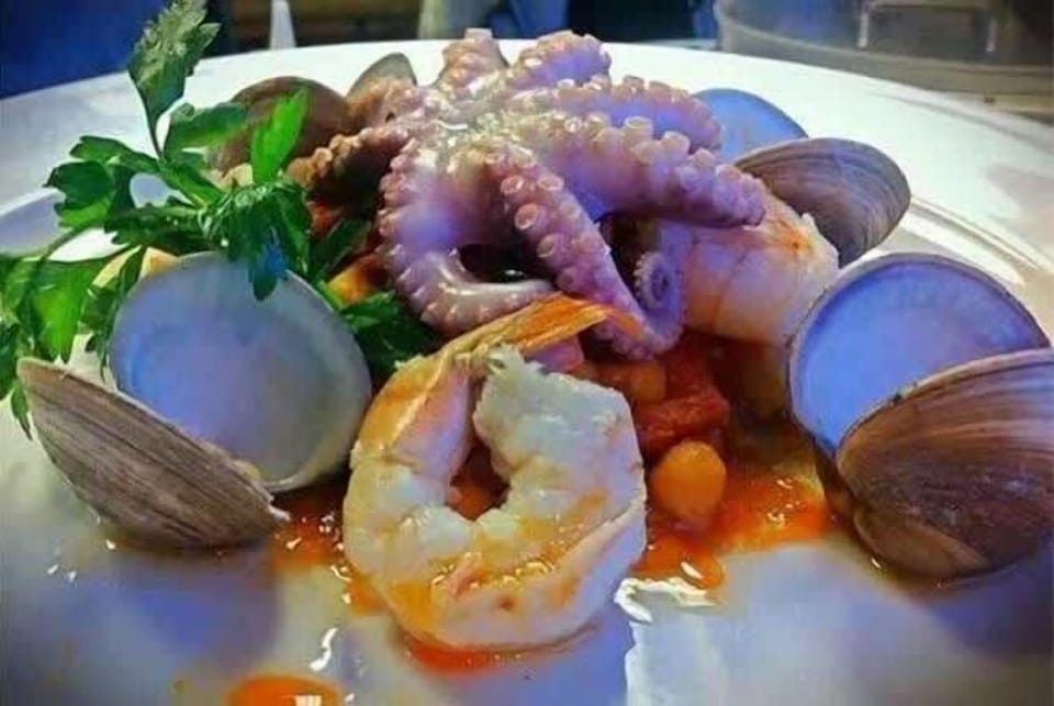 Indulge in fresh, local seafood cuisine, prepared to perfection for a true culinary delight.