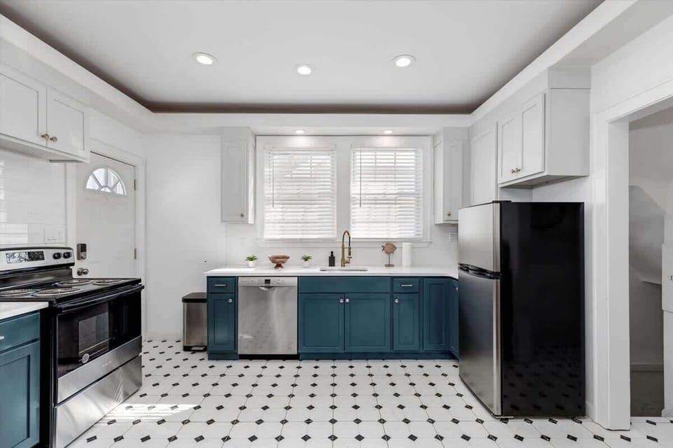 Kitchen with stainless appliances and ample storage.