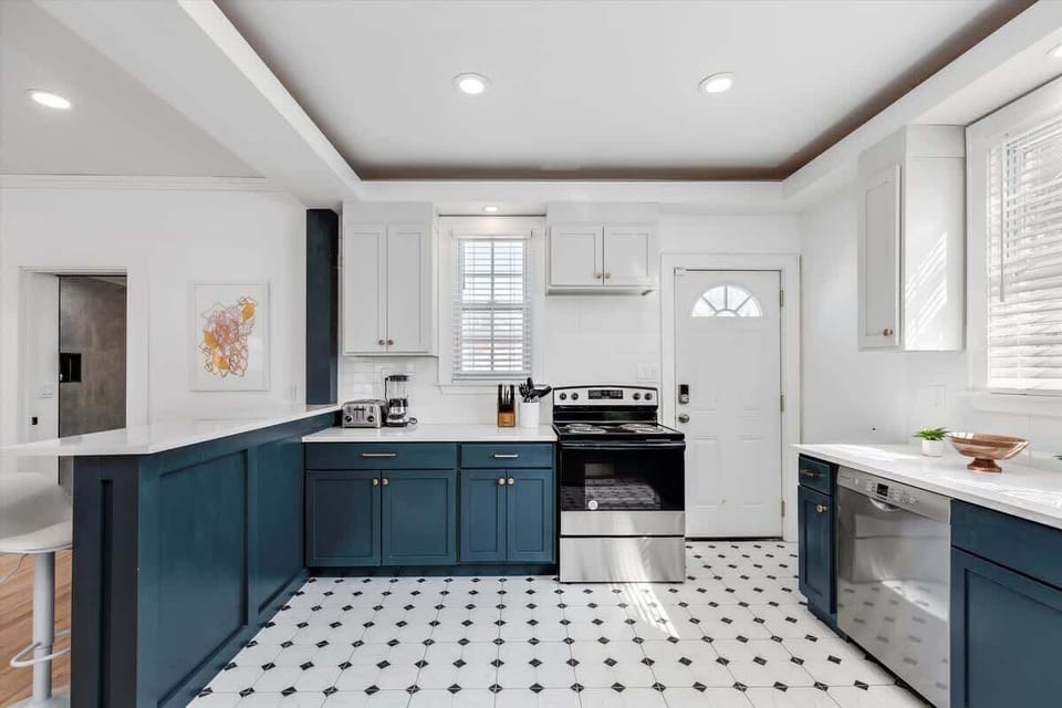 Kitchen with stainless appliances and ample storage.