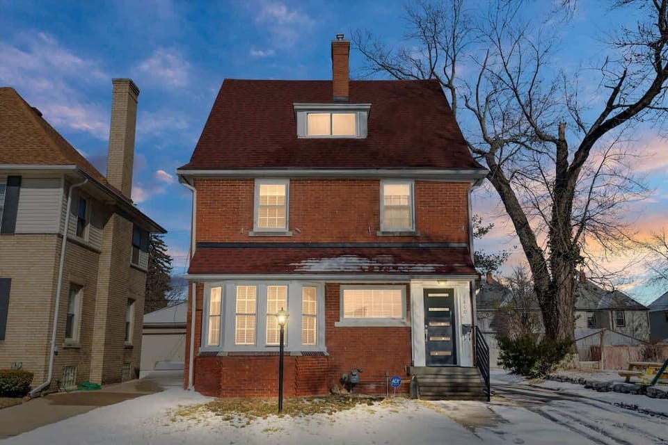 Charming brick exterior at dusk.