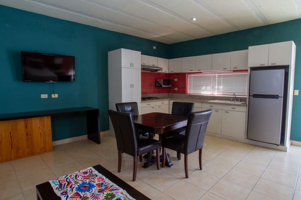 Family Studio Suite | Private kitchen | Full-size fridge, dishwasher, cookware/dishes/utensils