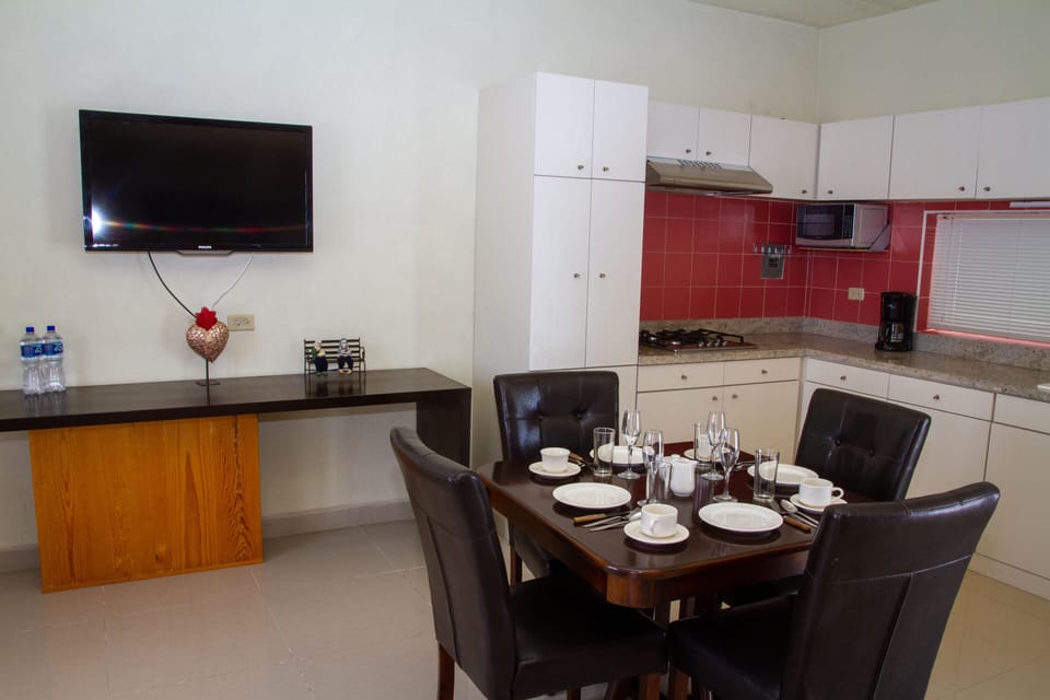 Family Studio Suite | Private kitchen | Full-size fridge, dishwasher, cookware/dishes/utensils