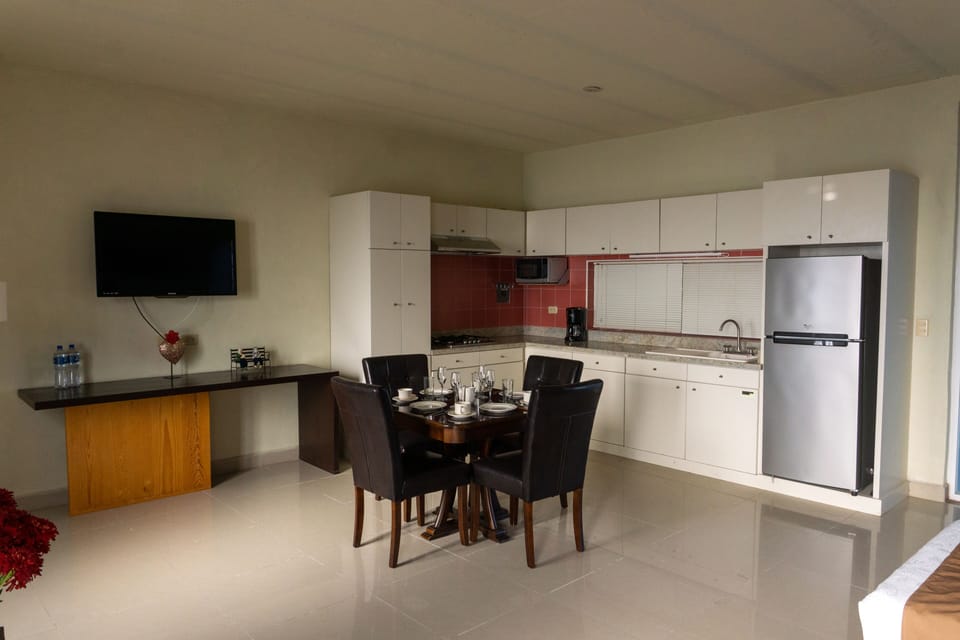 Family Studio Suite | Private kitchen | Full-size fridge, dishwasher, cookware/dishes/utensils