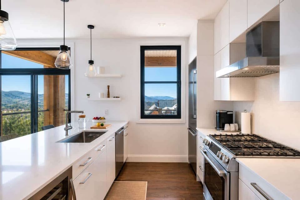 Full kitchen with 5 burner stainless steel stove.