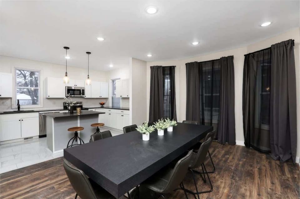 Dining area beside open kitchen.