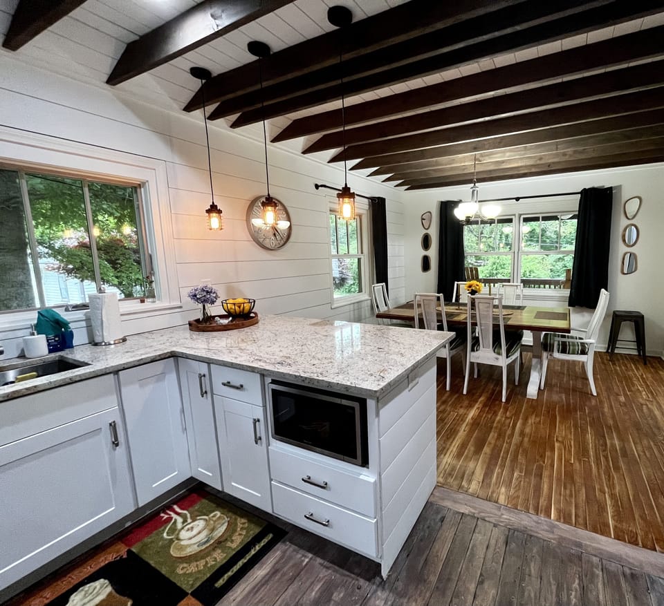 Full kitchen; electric range, microwave, dishwasher & refrigerator