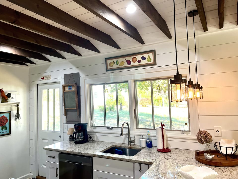 Spacious kitchen with granite countertops.