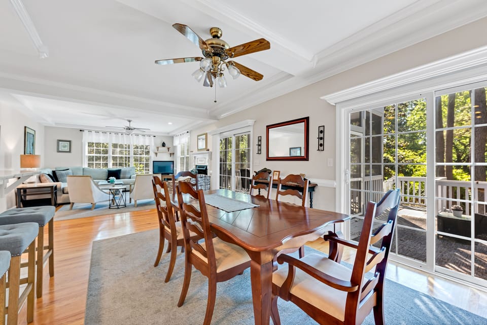 The dining area with sliding doors leading out to the deck