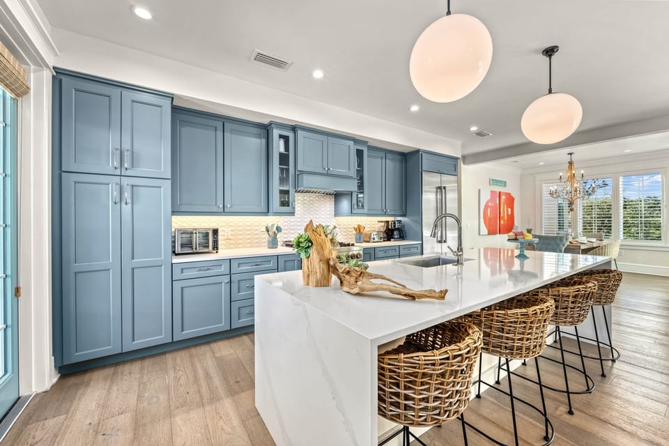 Whip up fresh local seafood dinners around the polished kitchen island with ease.