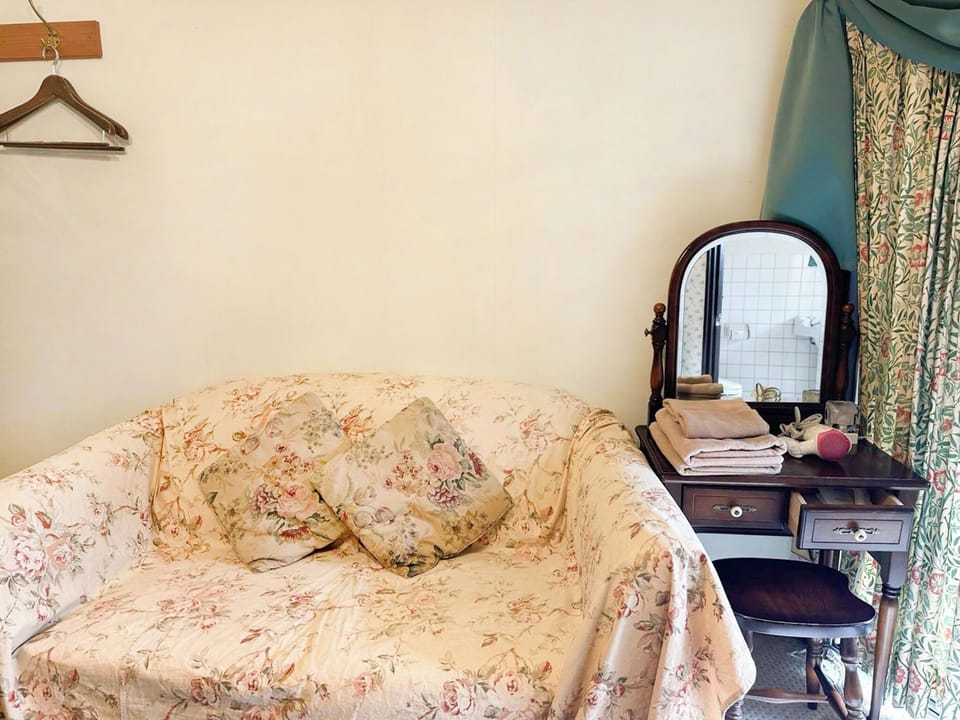 ・[Cottage 103: Facilities] A two-seater sofa and a dresser are also provided.