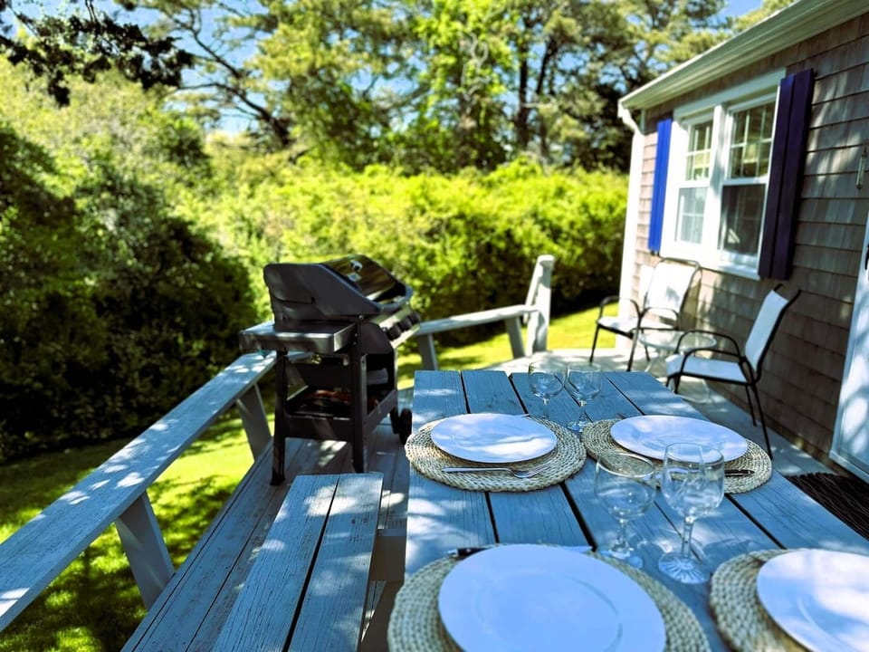 Back deck backs up to conservation land on one side (neighboring cottages on other side)