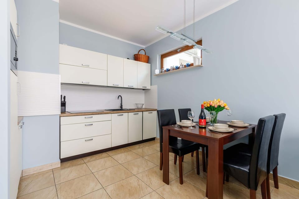 Another angle of the living room, showcasing the spacious seating area and its connection to the dining space.