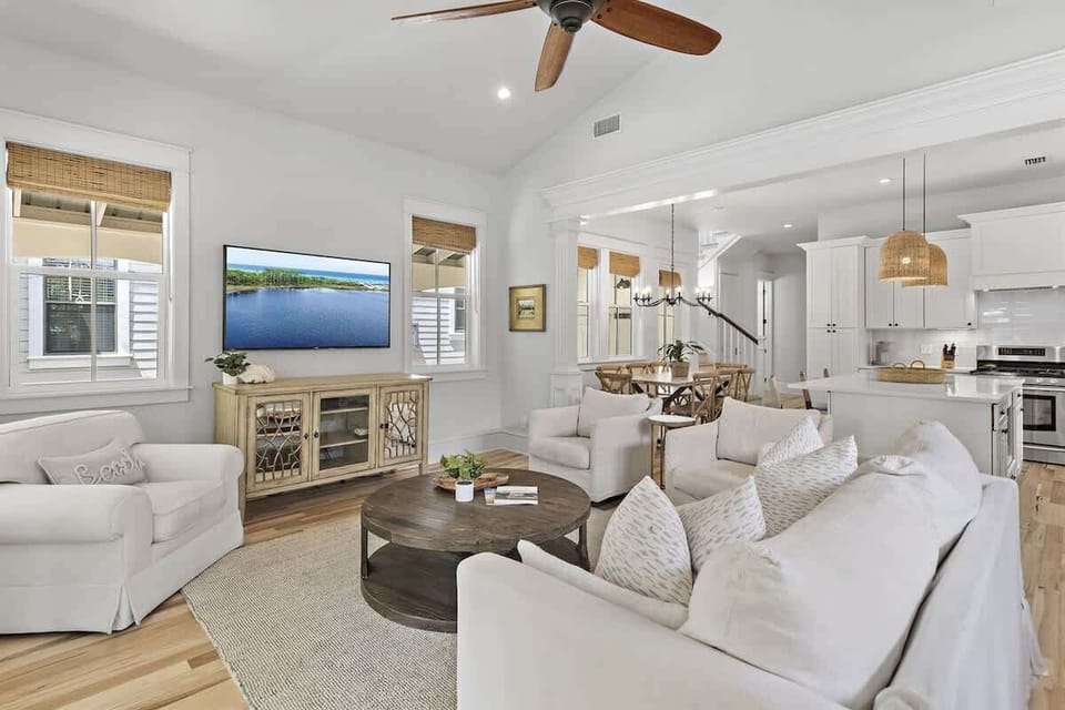 - Relax in this open concept living room featuring comfy seating and a large smart TV - Thoughtfully designed with natural textures, neutral tones, and modern beachy vibes - Perfect for family movie nights, morning coffee, or planning your next adven