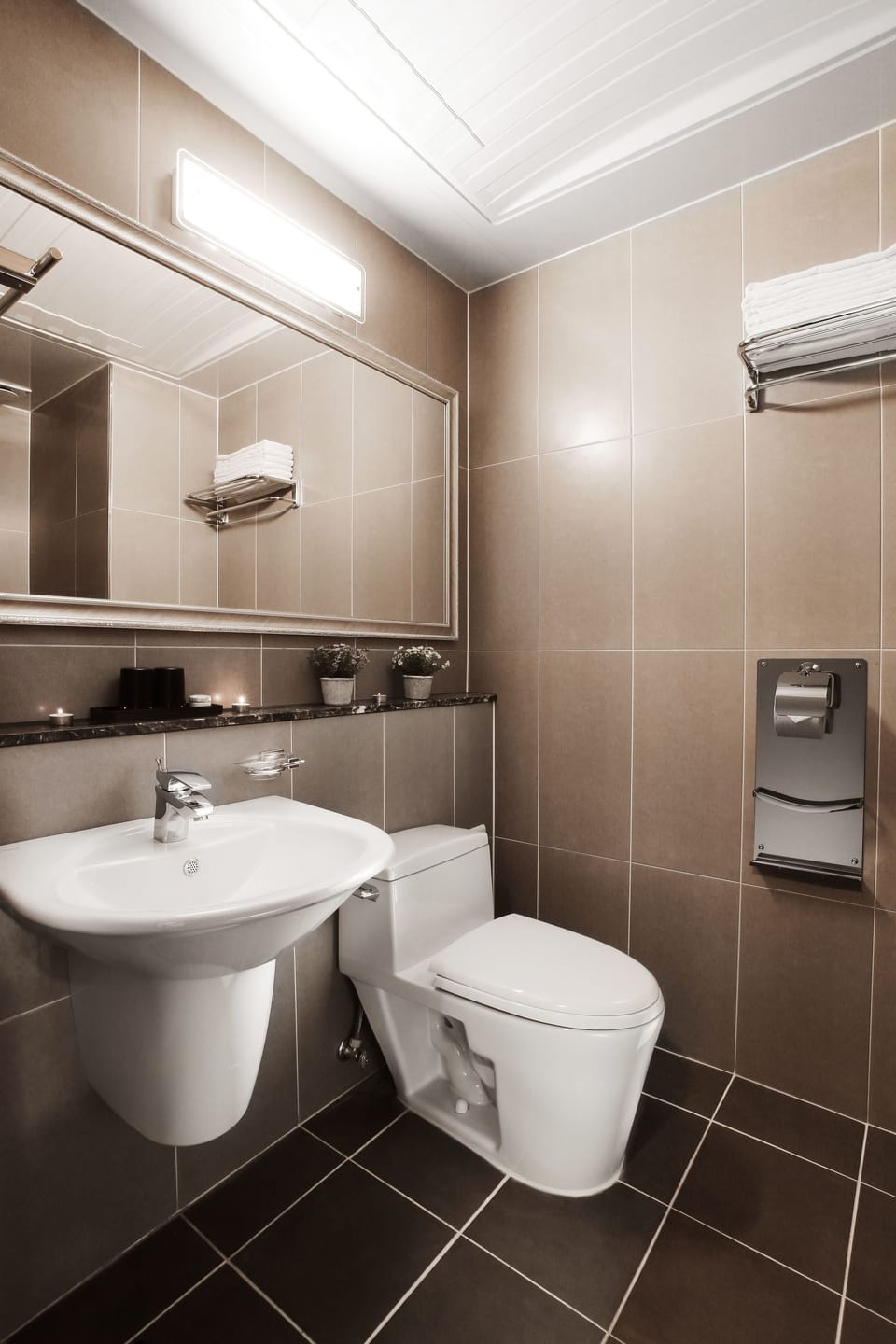 Shower, hair dryer, slippers, towels
