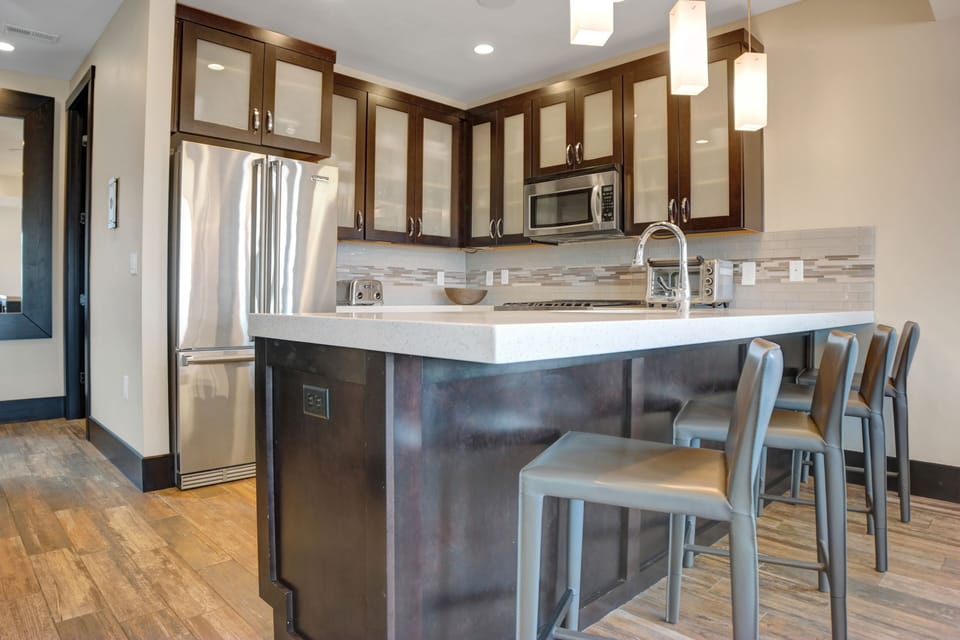 The kitchen island with seating for four guests.