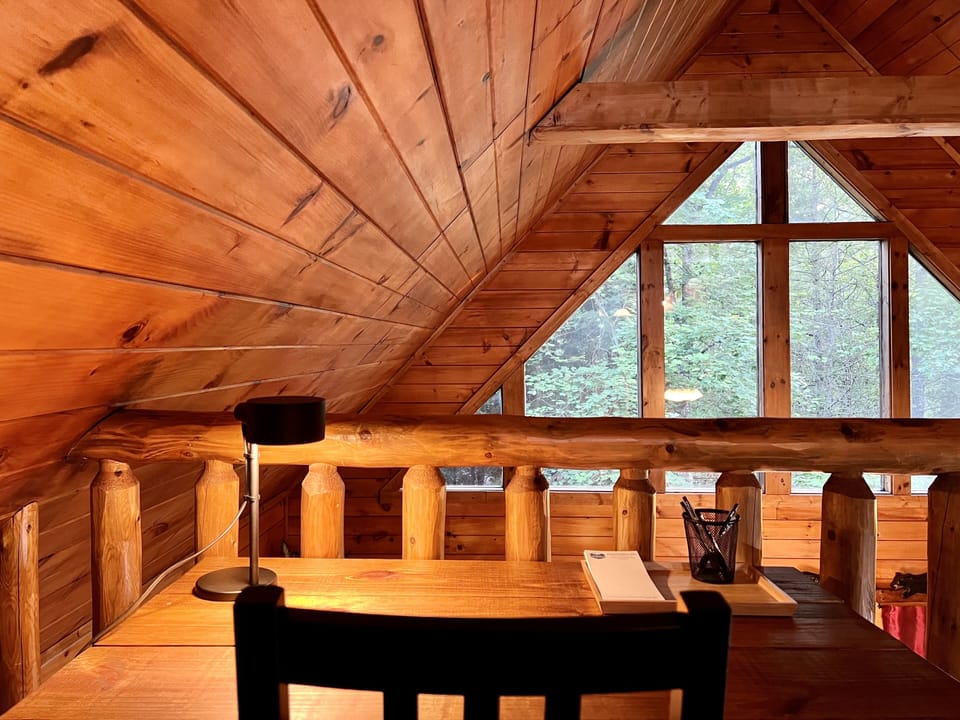 A desk in the loft...with a relaxing, wooded view