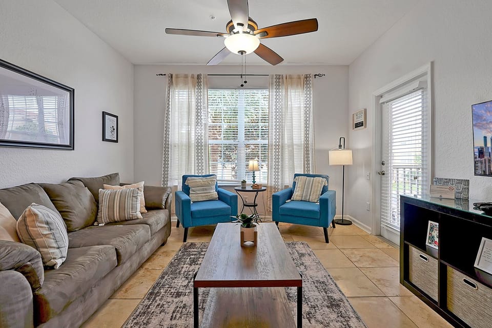Living Room: Relax in vibrant hues and sunny views – the perfect space for unwinding after adventure!