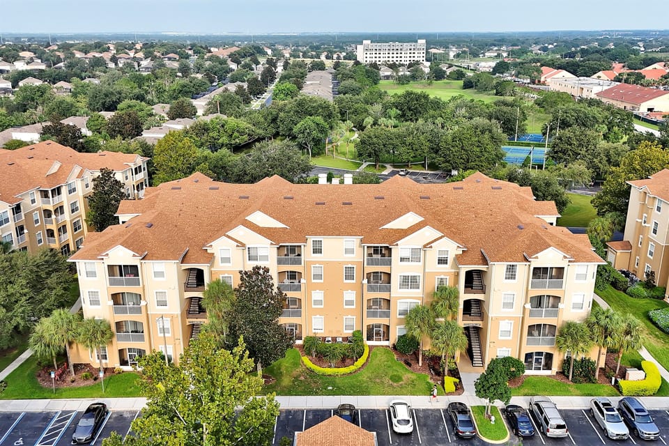 Your Windsor Hill's home away from home- secure gated resort with parking, palm lined paths, and easy access to all amenities