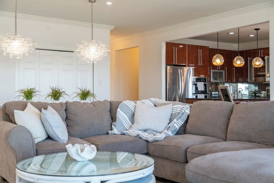 Comfy sofa in the living room with open floor plan and ample seating