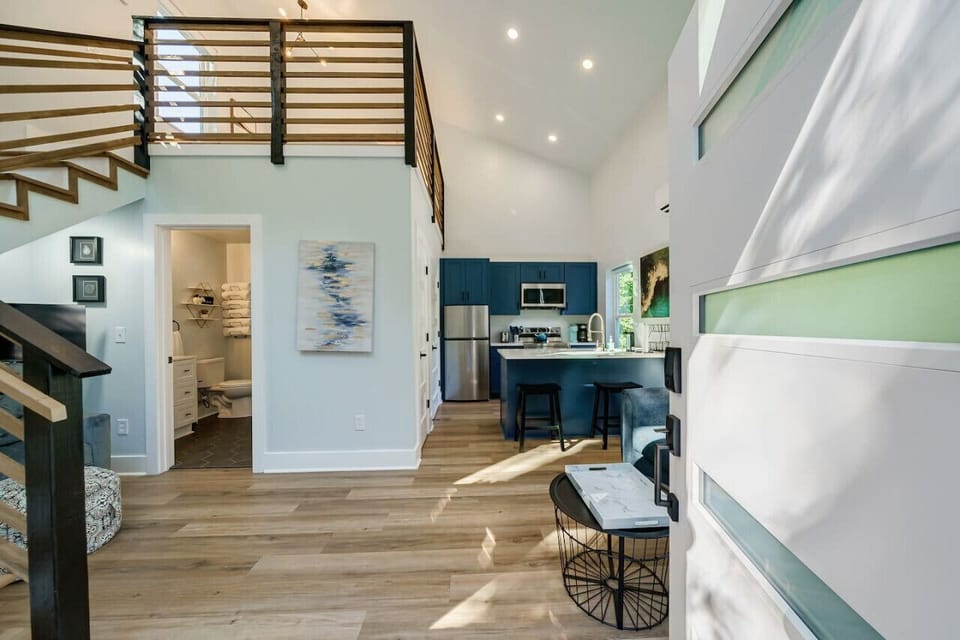 View from front door of living space, loft, bathroom and kitchen