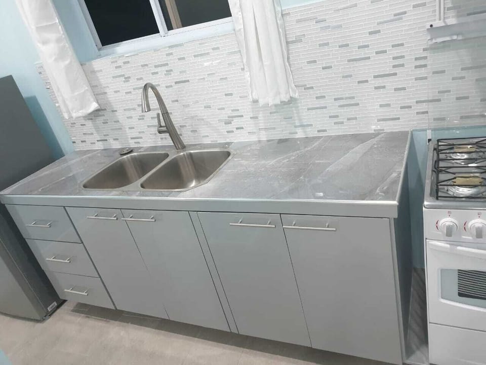 Classic Studio Suite | Private kitchen | Full-size fridge, microwave, oven, stovetop
