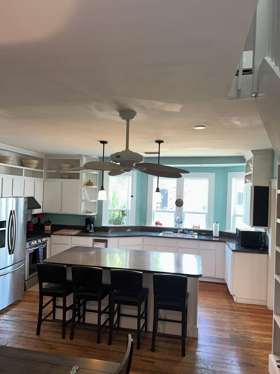 Full kitchen with eat at bar.