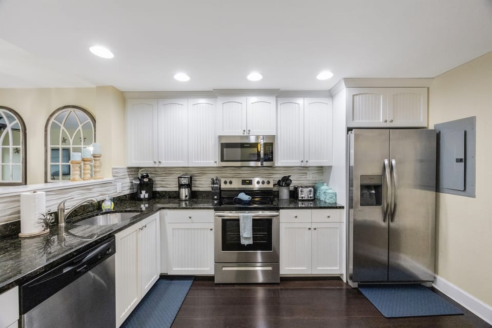 Kitchen fully stocked with cooking/eating utensils
