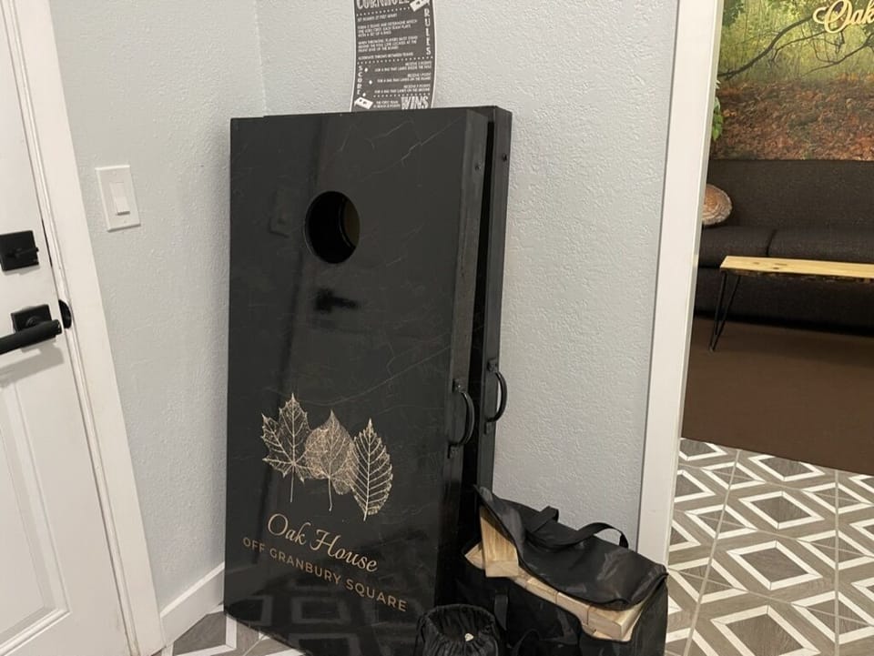 Outdoor games including cornhole and large jenga