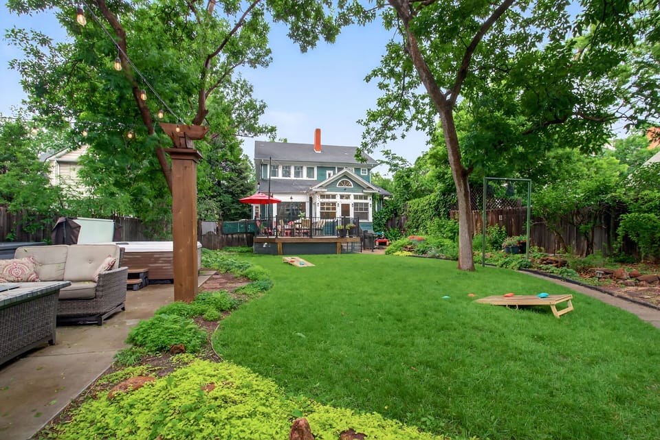 The backyard has yard games and comfortable patio