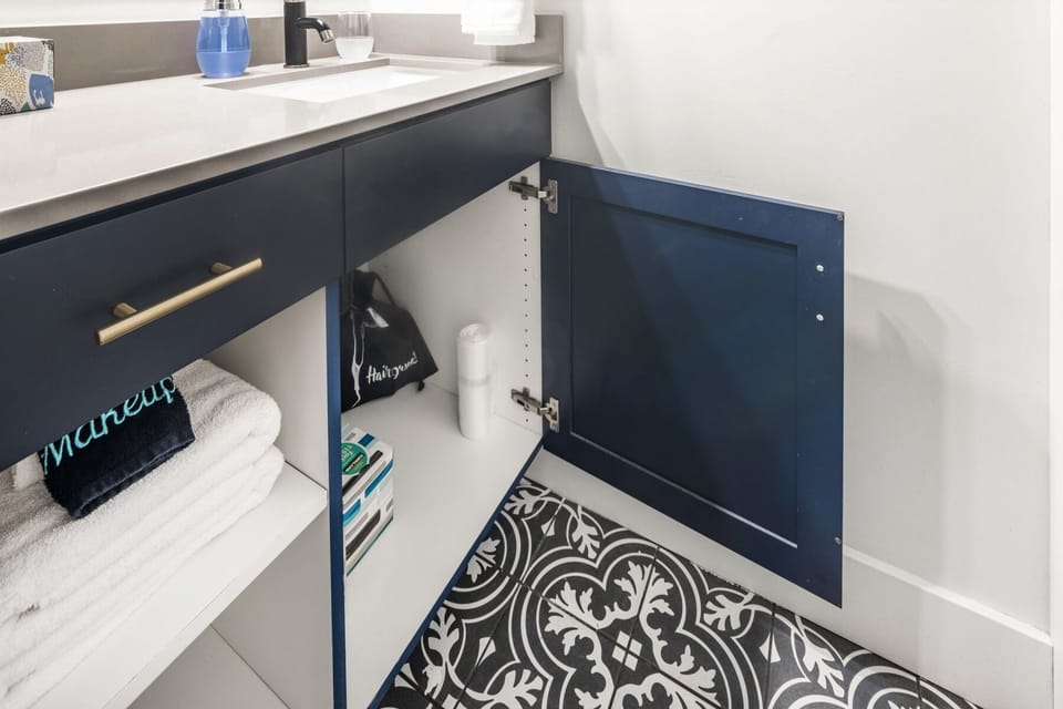 Blow dryer, extra towels, extra TP and Kleenex with bathroom garbage bags