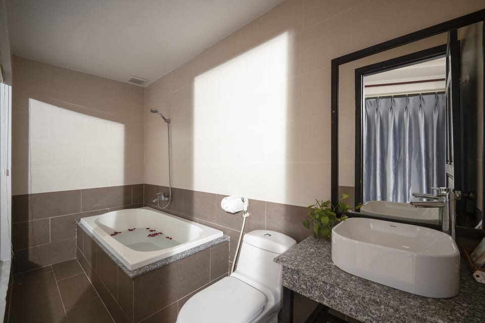Deluxe Triple Room, Balcony, City View | Bathroom | Designer toiletries, hair dryer, slippers, bidet