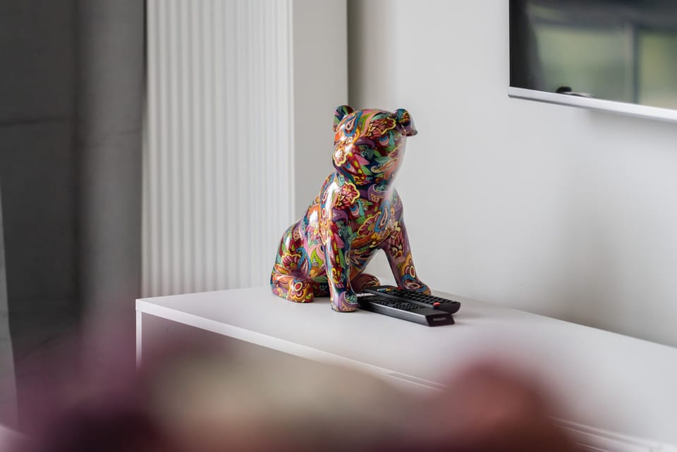 A colorful decorative statue on a table, adding a playful and artistic touch to the interior decor.
