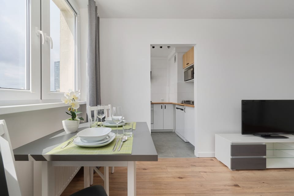 A modern dining nook near the kitchen, offering a functional and stylish space for meals.
