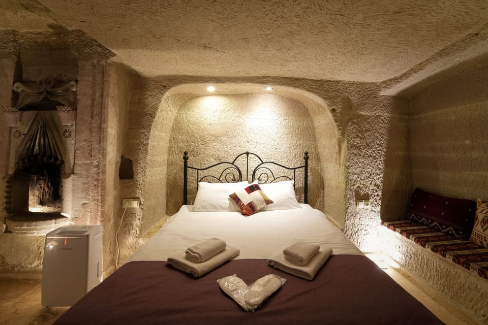 Cave Suite | Minibar, blackout drapes, iron/ironing board (on request), WiFi (free)