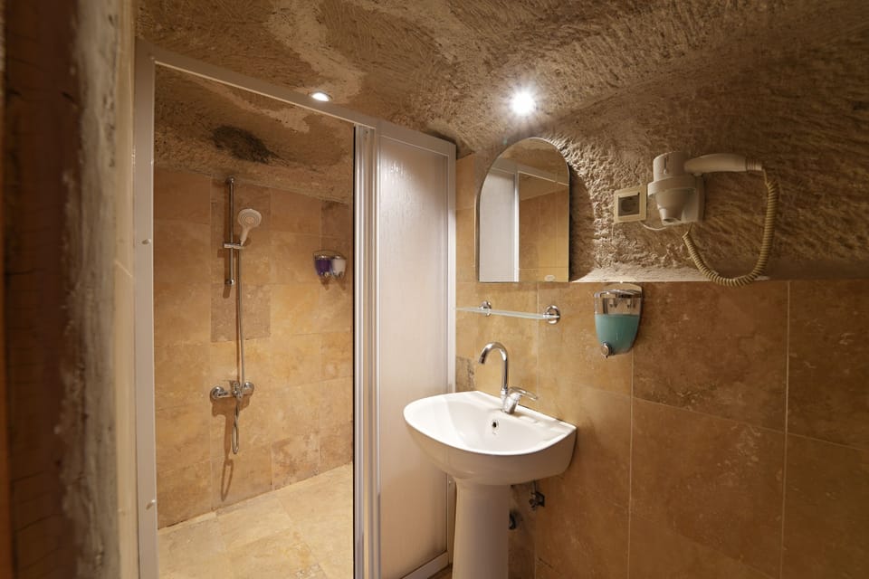 Fairy Chimney Room | Bathroom | Shower, hair dryer, slippers, towels