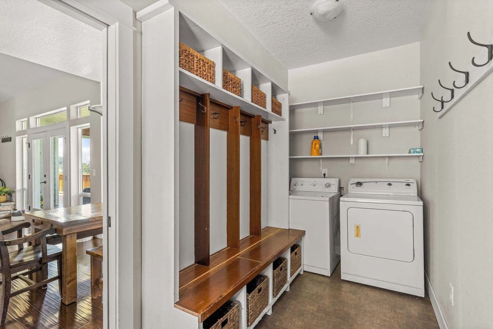 Functional mudroom with laundry facilities keeps your stay comfortable, organized, and stress-free.