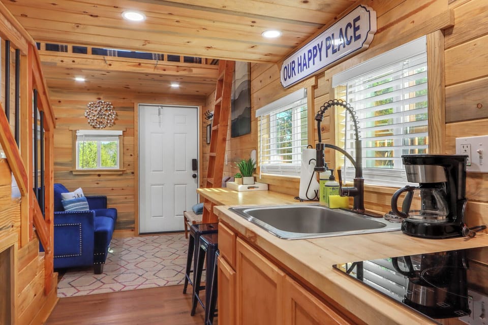 The kitchen is behind the living room
