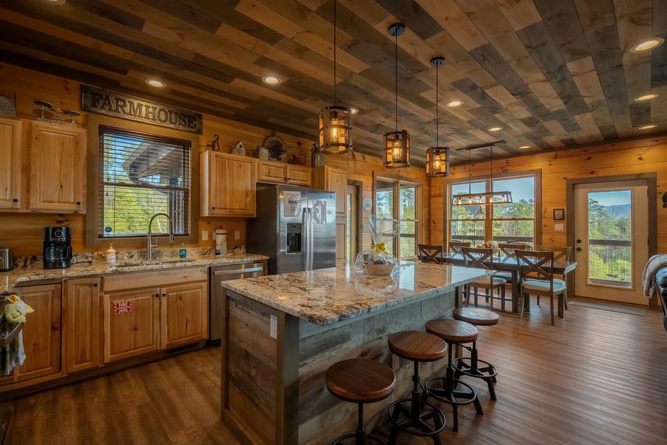 Huge Island with barstools.  Fully stocked kitchen.