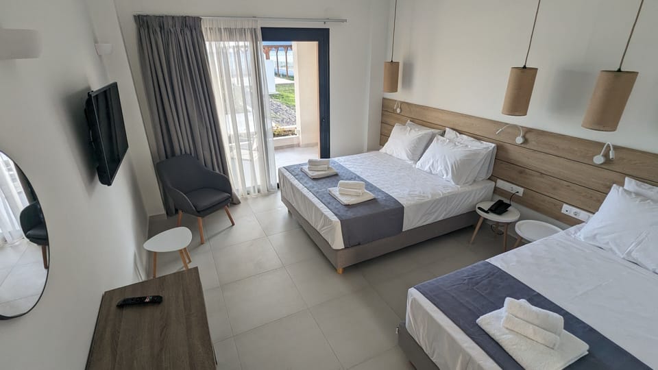 Triple Room | Deluxe Pool & Sea View | Premium bedding, minibar, desk, laptop workspace