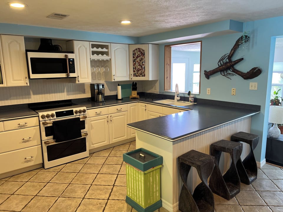 Kitchen with bar area for extra places to sit and eat
