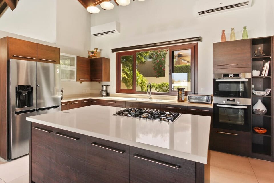 The kitchen also has a gas stovetop, a microwave, a toaster, and an 18-cupprogramable coffee maker.