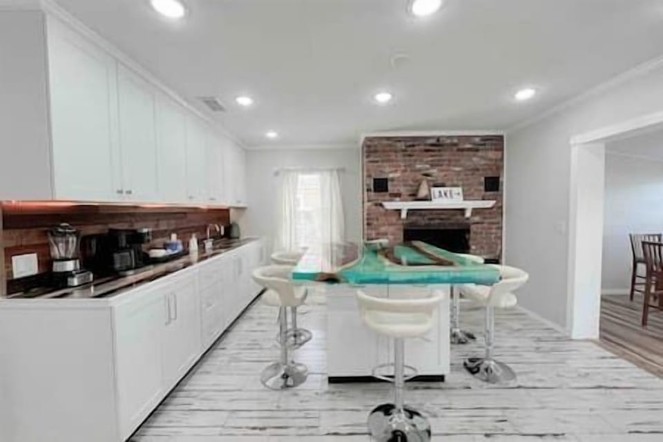 Fully Stocked Coffee Bar w/ Dual Coffee Maker & Tea Options Alongside Breakfast Nook