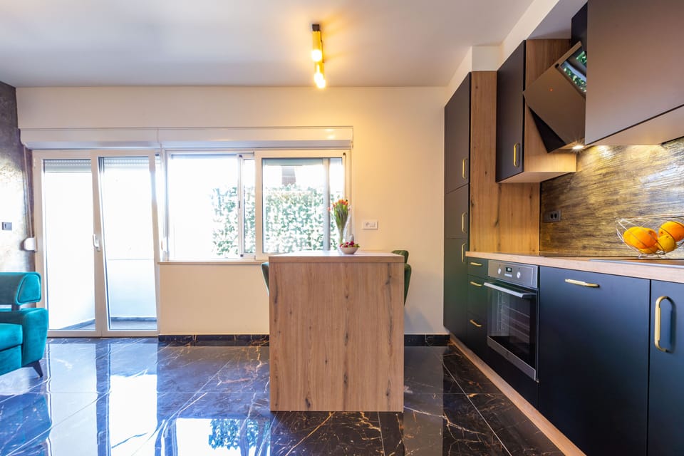 Exclusive Apartment | Living area | 48-inch LED TV with cable channels, TV, heated floors