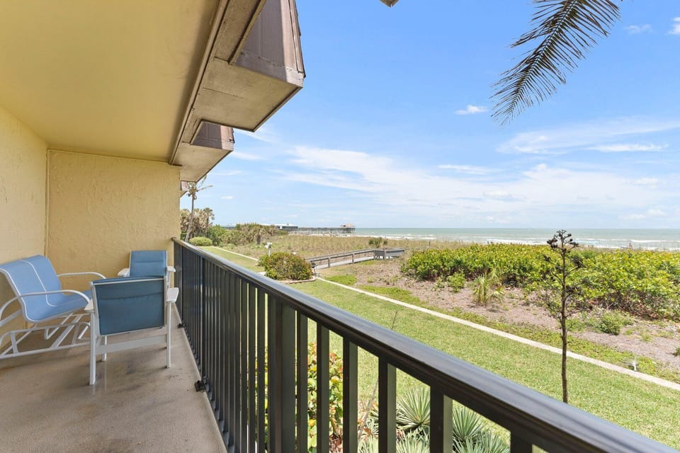 Enjoy your morning coffee with serene ocean and pier views.