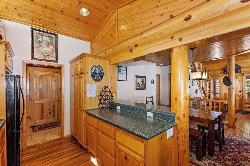 Plenty of counterspace and elevated countertop with barstool seating on the other side. 