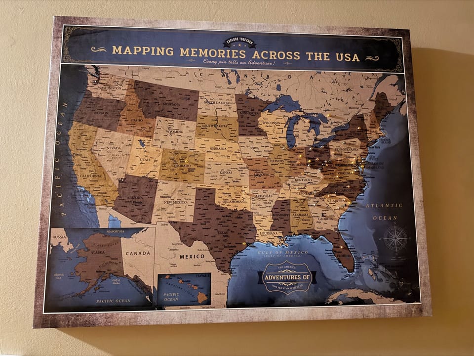 Travelers Map with pins guests have inserted showing where they have came from.