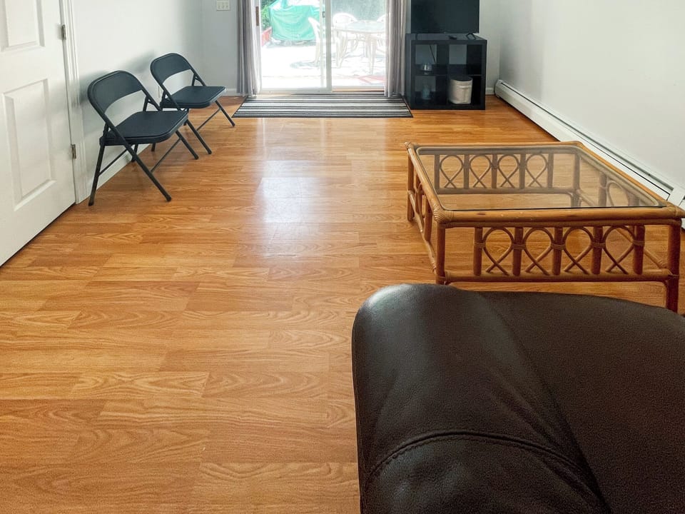 Living area downstairs with sliders to a deck