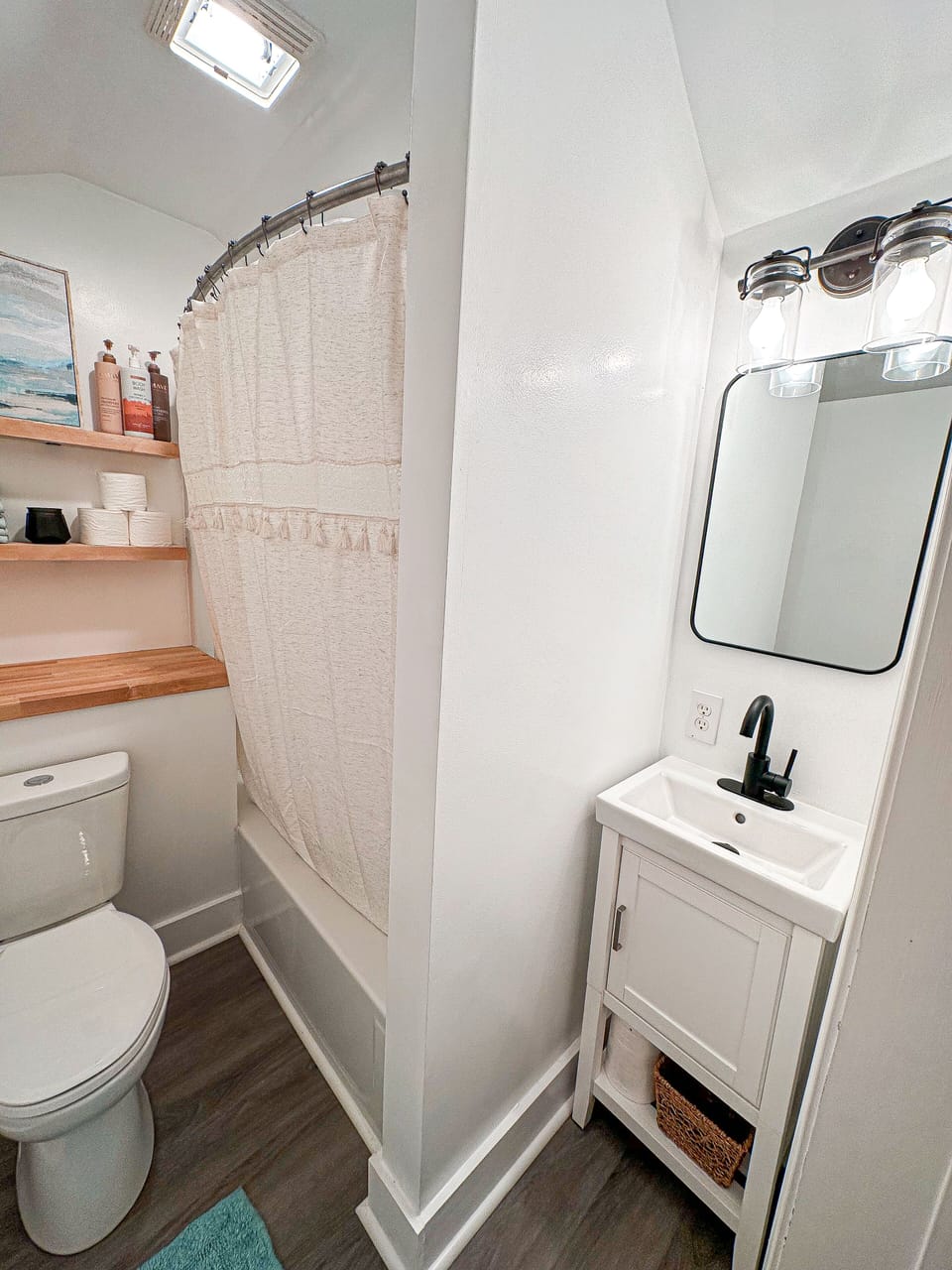 Updated bathroom space stocked with towels and soaps
