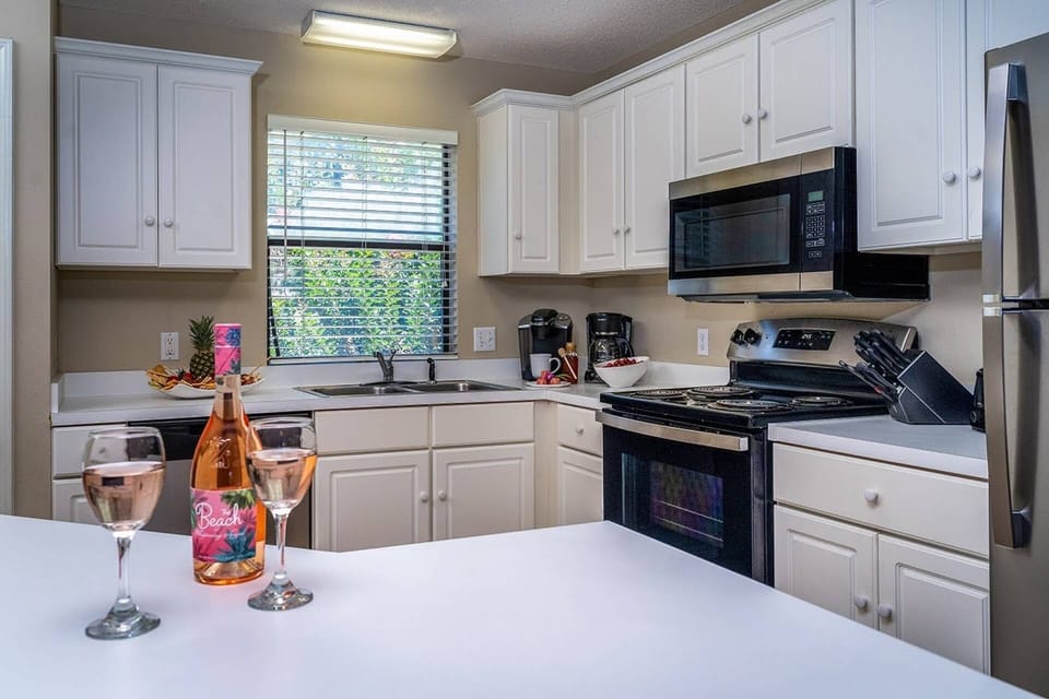 Kitchen equipped with New Stainless Steel Appliances ~ Refrigerator, Electric Oven & Cooktop, Dishwasher, Microwave, Keurig & Coffee Maker, Blender &