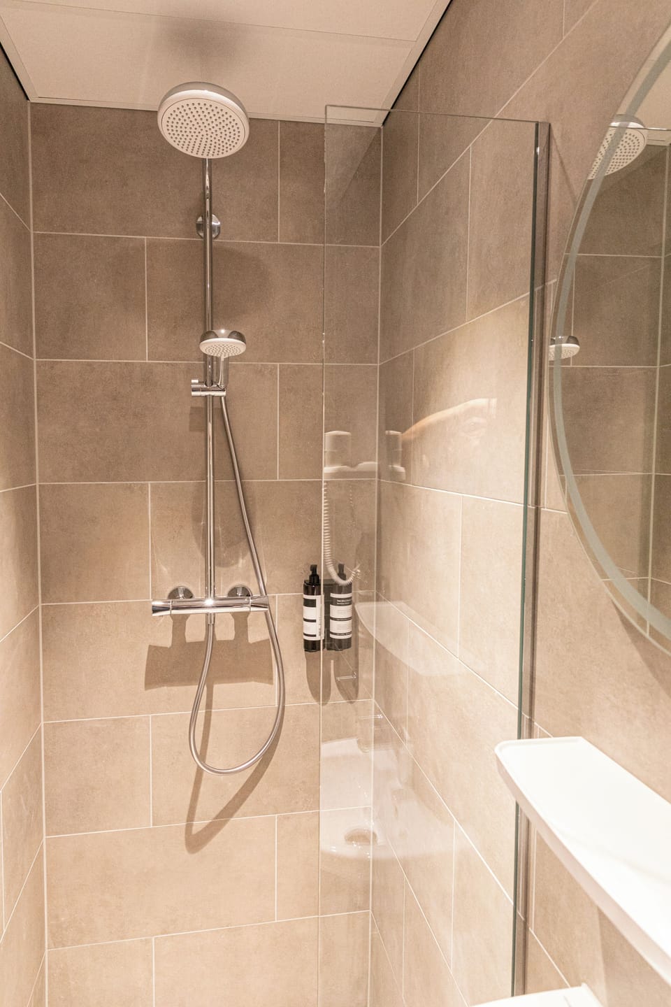 Shower, rainfall showerhead, hair dryer, towels